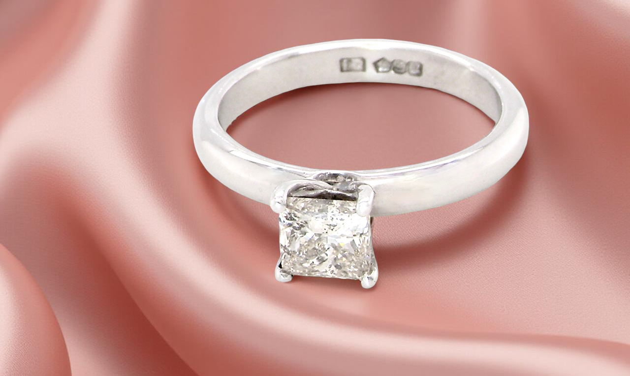 solitaire ring featuring a stunning 0.78 carat Princess-cut white diamond