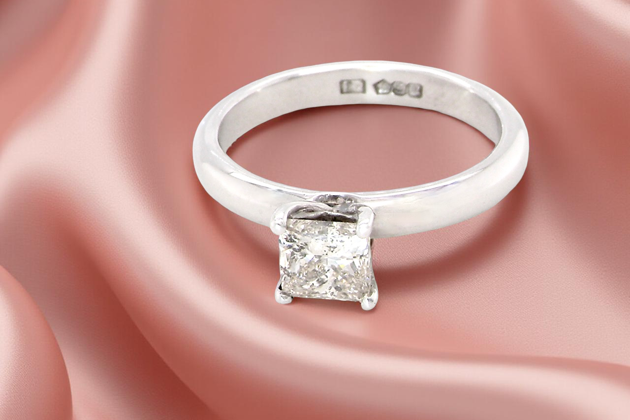 solitaire ring featuring a stunning 0.78 carat Princess-cut white diamond