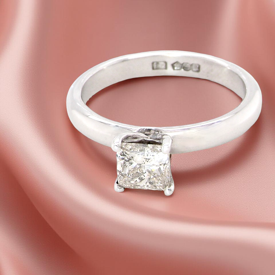 solitaire ring featuring a stunning 0.78 carat Princess-cut white diamond