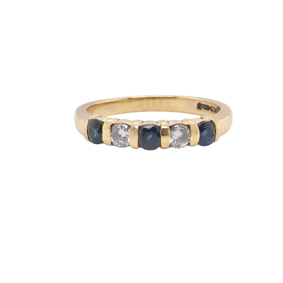 18-carat gold half-hoop eternity ring, set with three round mid-blue sapphires