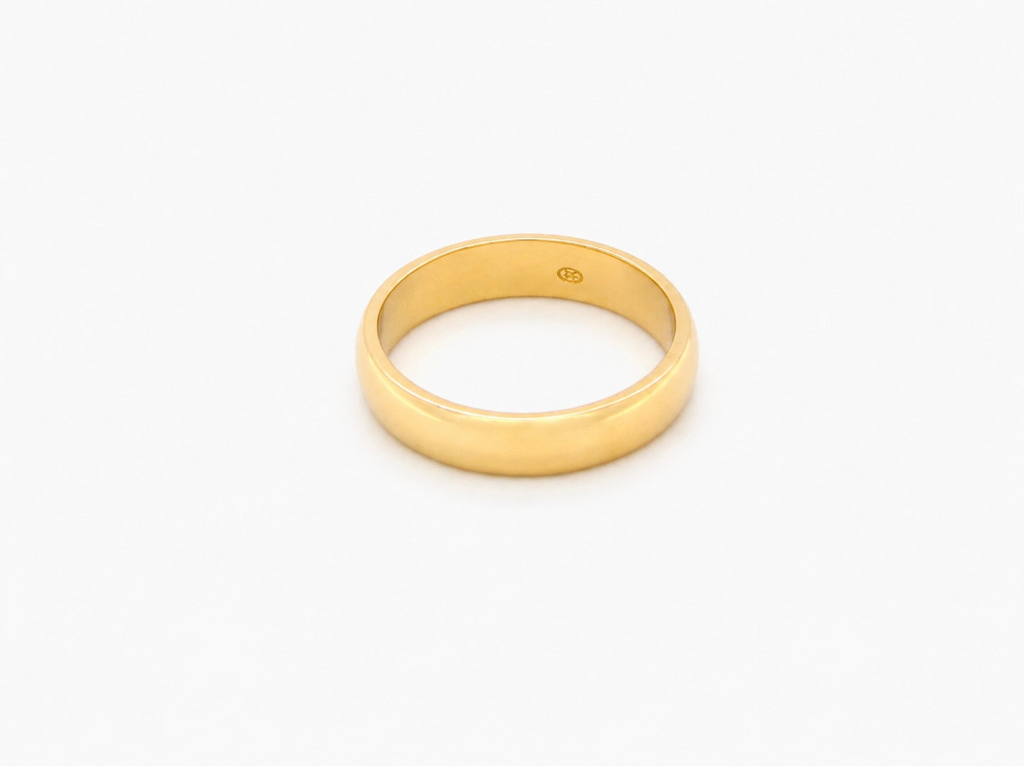 A traditional 18 carat gold wedding ring. D shape profile.
Substantial weight at 5.6grams