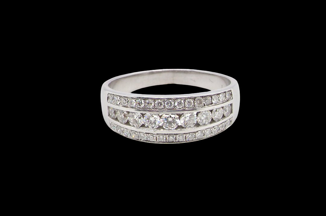 18 carat white gold half hoop ring. Set with a middle row of nine bright white brilliant cut diamonds, graduate from 2.2mm to 2.6mm. The top and bottom rows are also set with small diamonds.