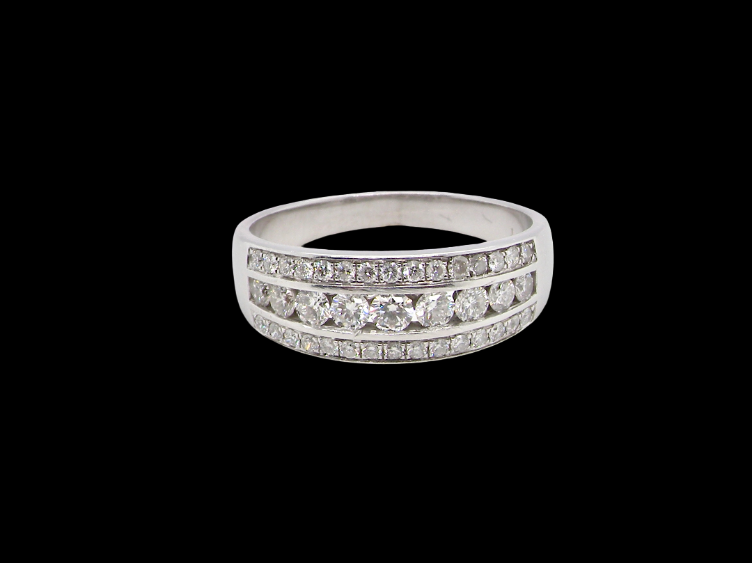 18 carat white gold half hoop ring. Set with a middle row of nine bright white brilliant cut diamonds, graduate from 2.2mm to 2.6mm. The top and bottom rows are also set with small diamonds.