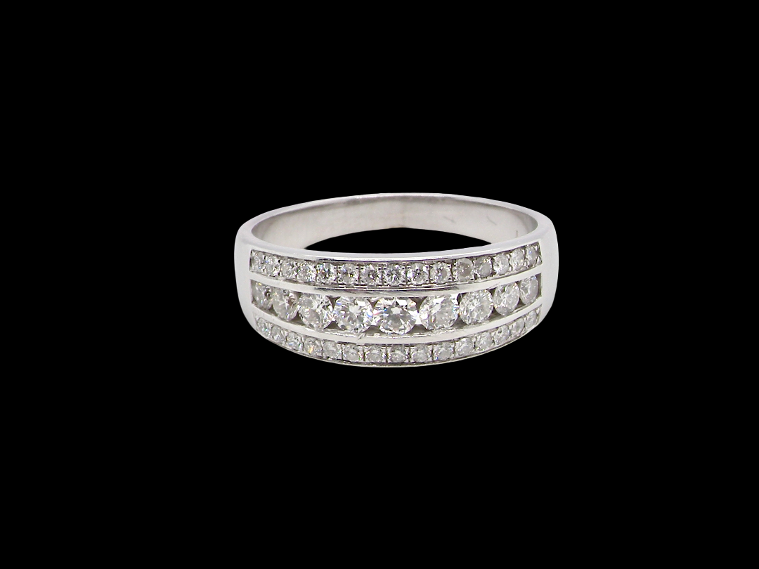 18 carat white gold half hoop ring. Set with a middle row of nine bright white brilliant cut diamonds, graduate from 2.2mm to 2.6mm. The top and bottom rows are also set with small diamonds.