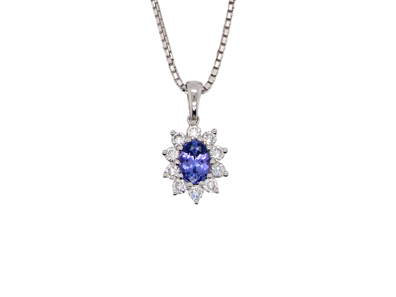 18 carat white gold pendant featuring a captivating oval tanzanite