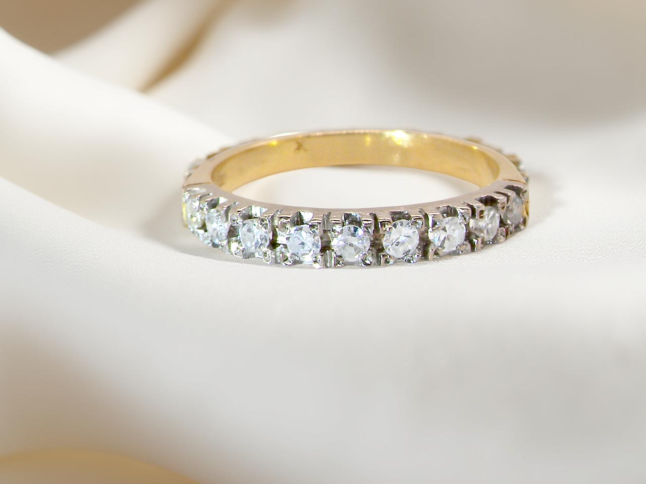 1970s vintage half-hoop eternity ring, tested as 18 carat gold and elegantly set white diamonds.