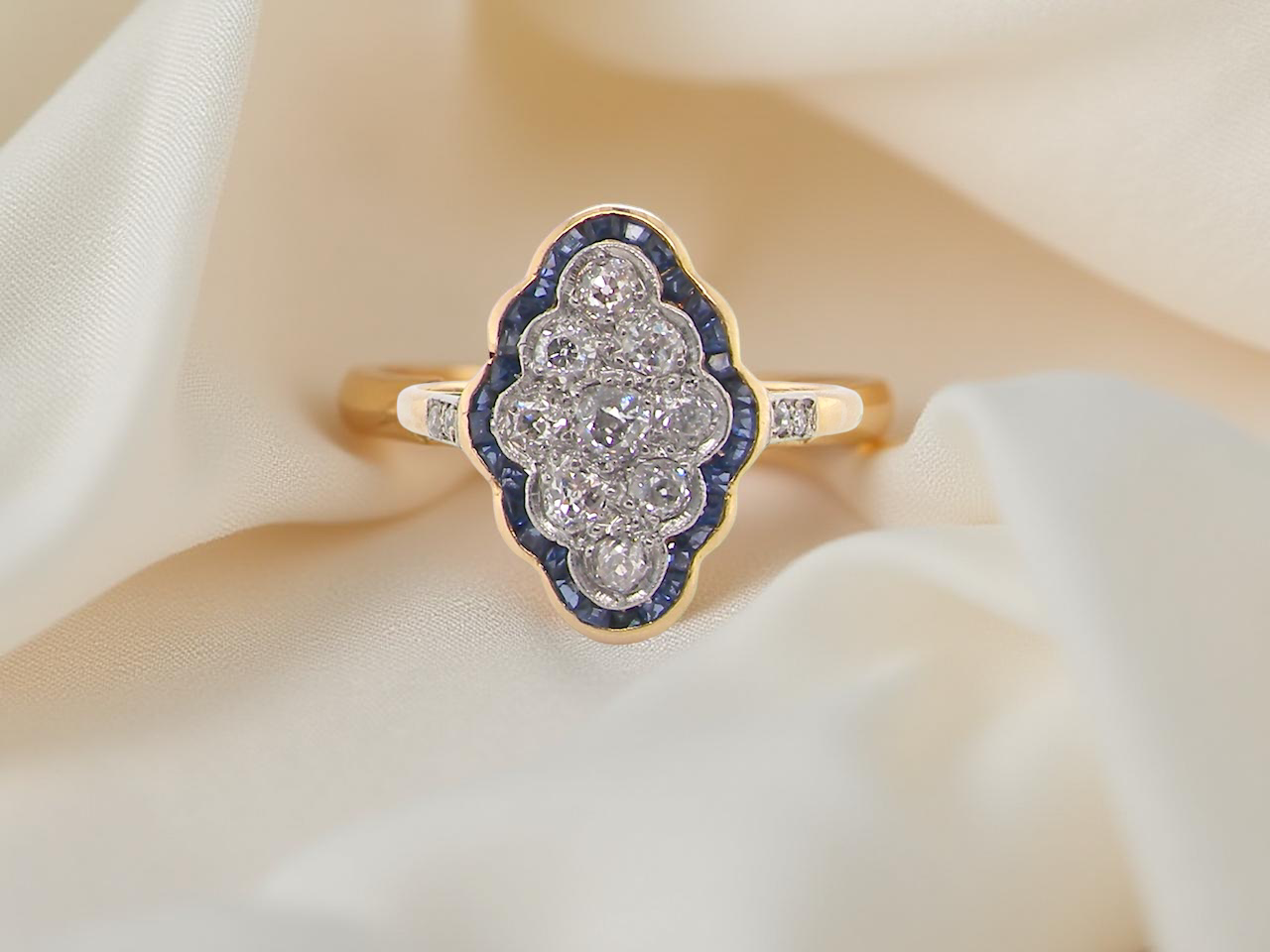 An Art Deco sapphire and diamond cluster ring