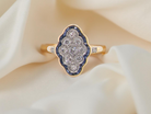An Art Deco sapphire and diamond cluster ring