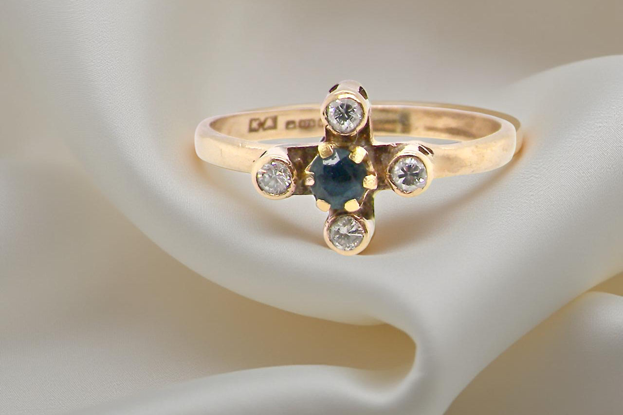 A 9 carat gold sapphire and diamond ring