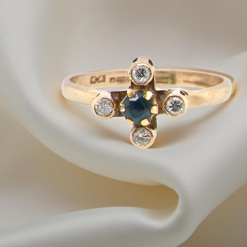A 9 carat gold sapphire and diamond ring
