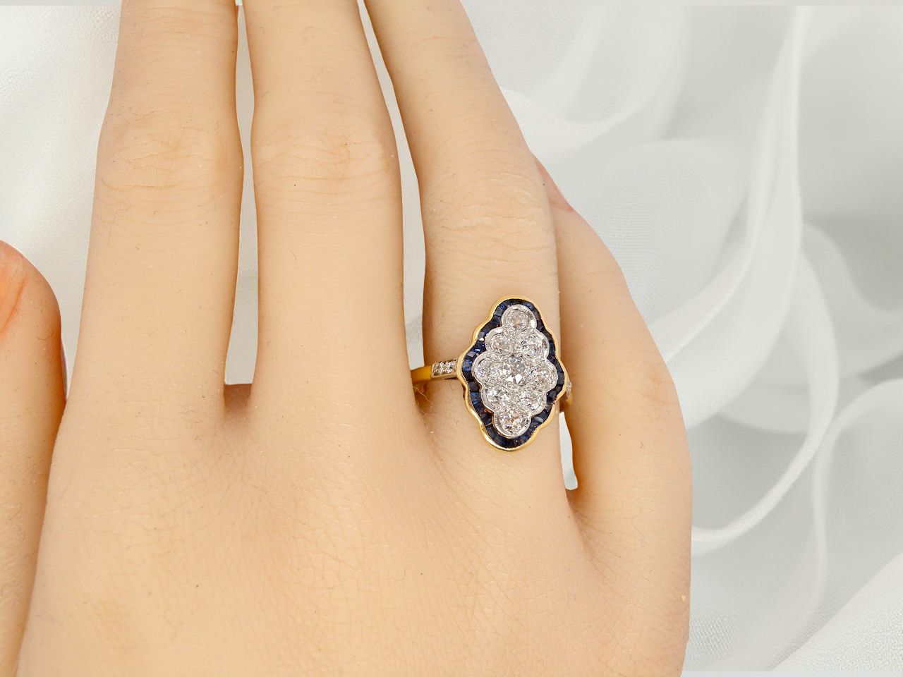 An Art Deco sapphire and diamond cluster ring