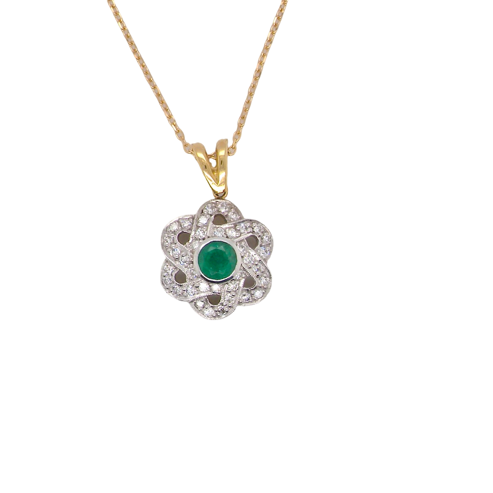 8 carat gold pendant that features to the centre a round emerald