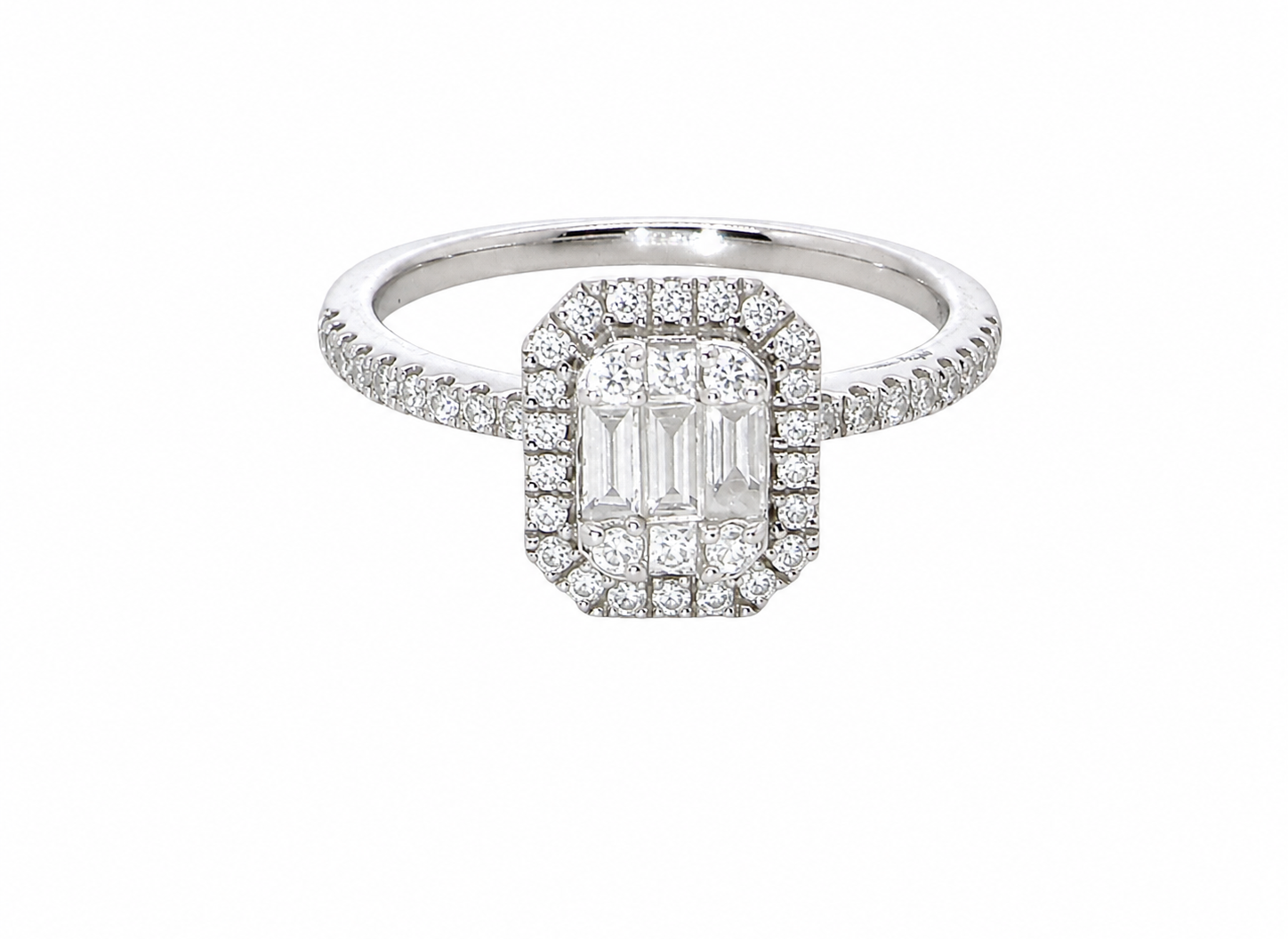 A rectangular diamond cluster ring. Centre portion is set with three baguette cut white diamonds 3x1.6mm and six mixed cut diamonds 2mm each.
Surrounded by a halo of twenty two small round diamonds