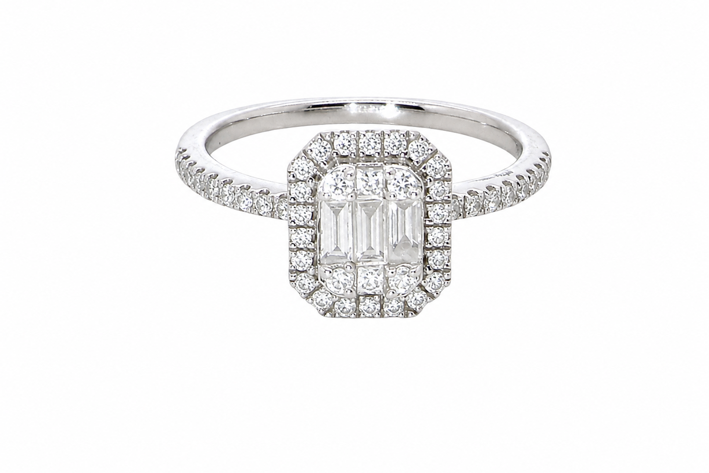 A rectangular diamond cluster ring. Centre portion is set with three baguette cut white diamonds 3x1.6mm and six mixed cut diamonds 2mm each.
Surrounded by a halo of twenty two small round diamonds