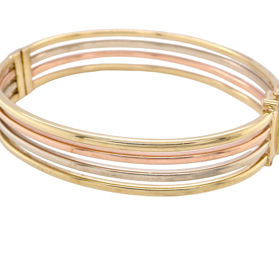 9 carat gold bangle. Solid bands of rose, yellow and white gold