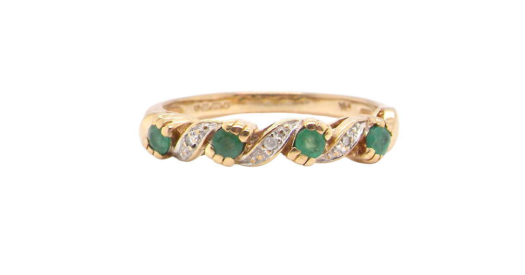 9 carat gold half hoop eternity ring. Set with four 2.4mm emeralds.
Set in alternate sections, a 'lazy S' design,