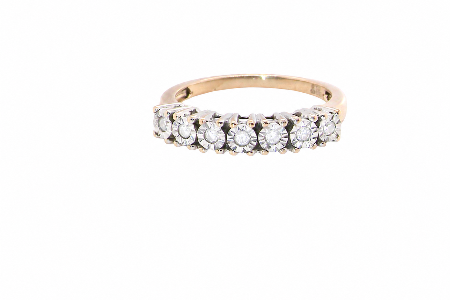 9 carat gold half hoop eternity ring.
Set with seven small white diamonds, each 1.8mm within an illusion setting that is 3.8mm in diameter, and white