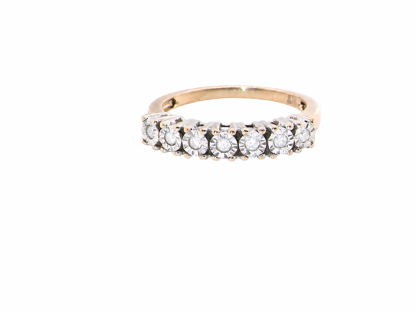 9 carat gold half hoop eternity ring.
Set with seven small white diamonds, each 1.8mm within an illusion setting that is 3.8mm in diameter, and white