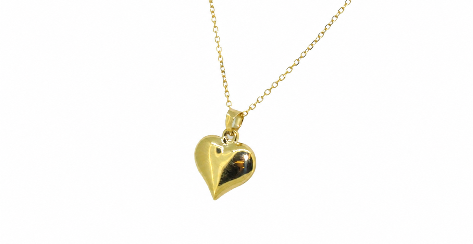 A 9ct gold patterned heart pendant reverse view