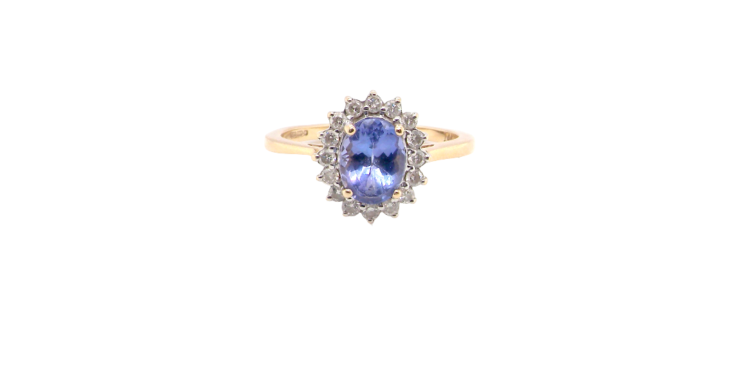 A 14 carat gold cluster ring. Features to the centre an oval cut cornflower blue sapphire, 8x6mm (est 1.25 carats), four claw setting.