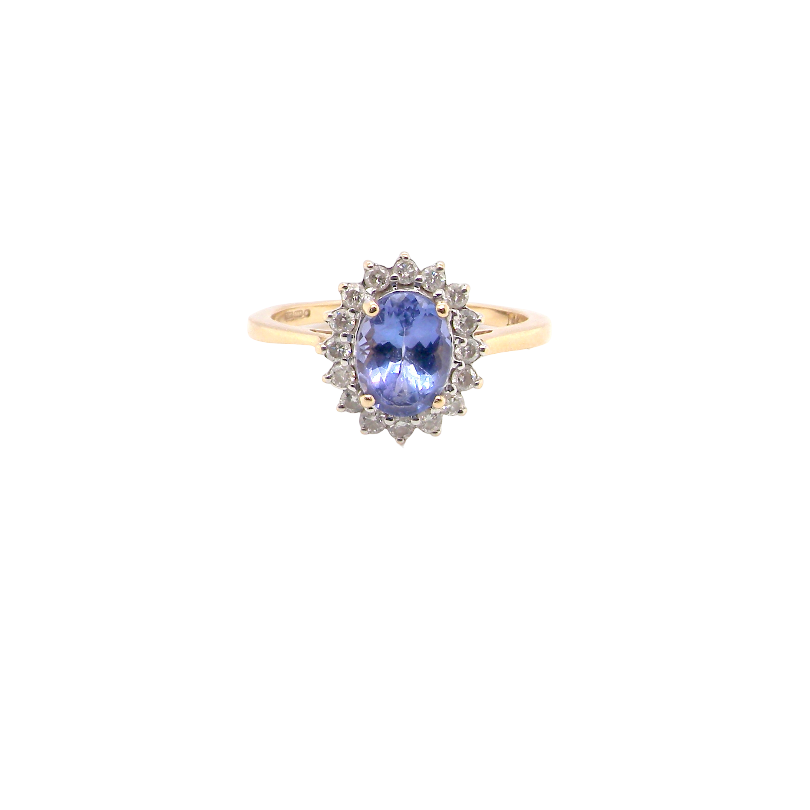 A 14 carat gold cluster ring. Features to the centre an oval cut cornflower blue sapphire, 8x6mm (est 1.25 carats), four claw setting.