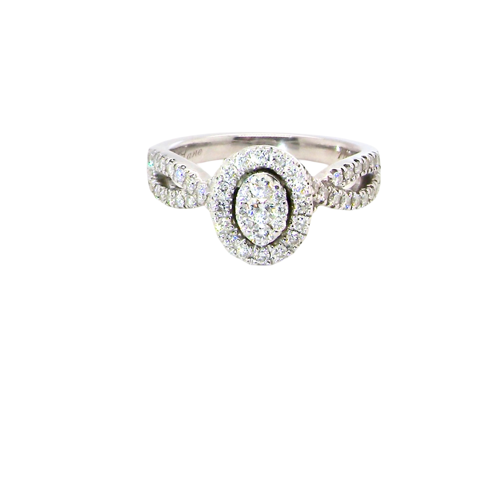 A 14 carat white gold cluster ring. The centre cluster an oval setting with nine small white diamonds.
Around the outside a halo of sixteen smaller diamonds,