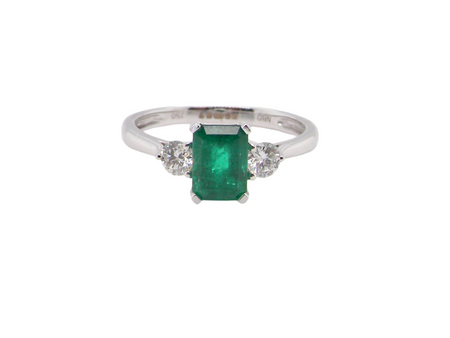 A NEW three stone Emerald and Diamond ring