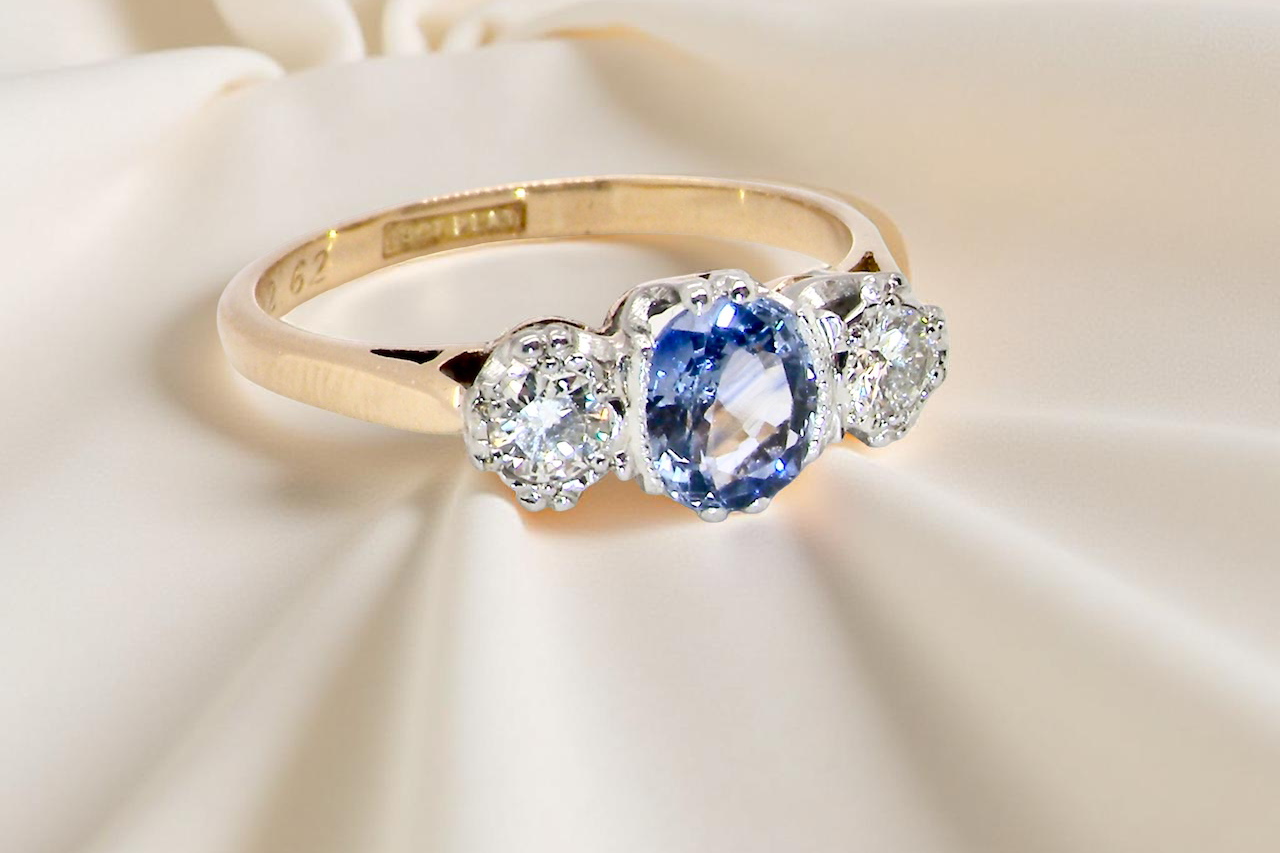 A 3 stone sapphire and diamond ring-C
