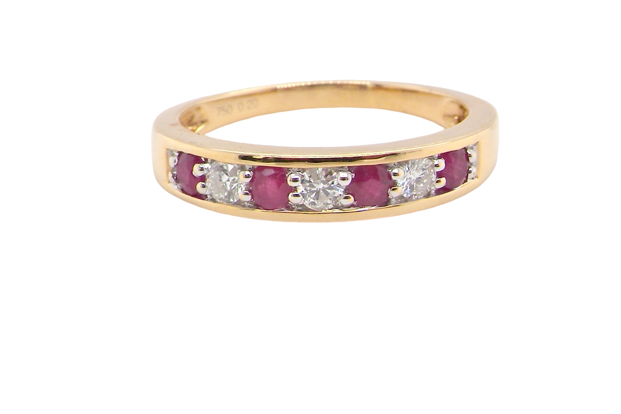 A seven stone Ruby and Diamond eternity ring