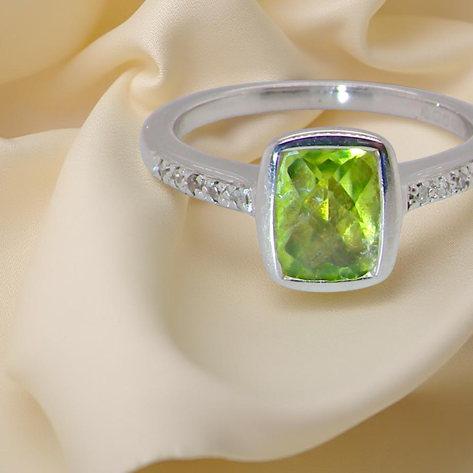 A 9 Carat White Gold Peridot & Diamond Ring