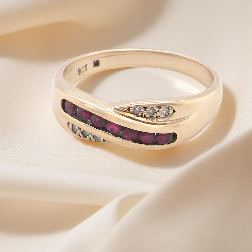 A 9 carat Gold Eternity Ring with Rubies and Diamonds
