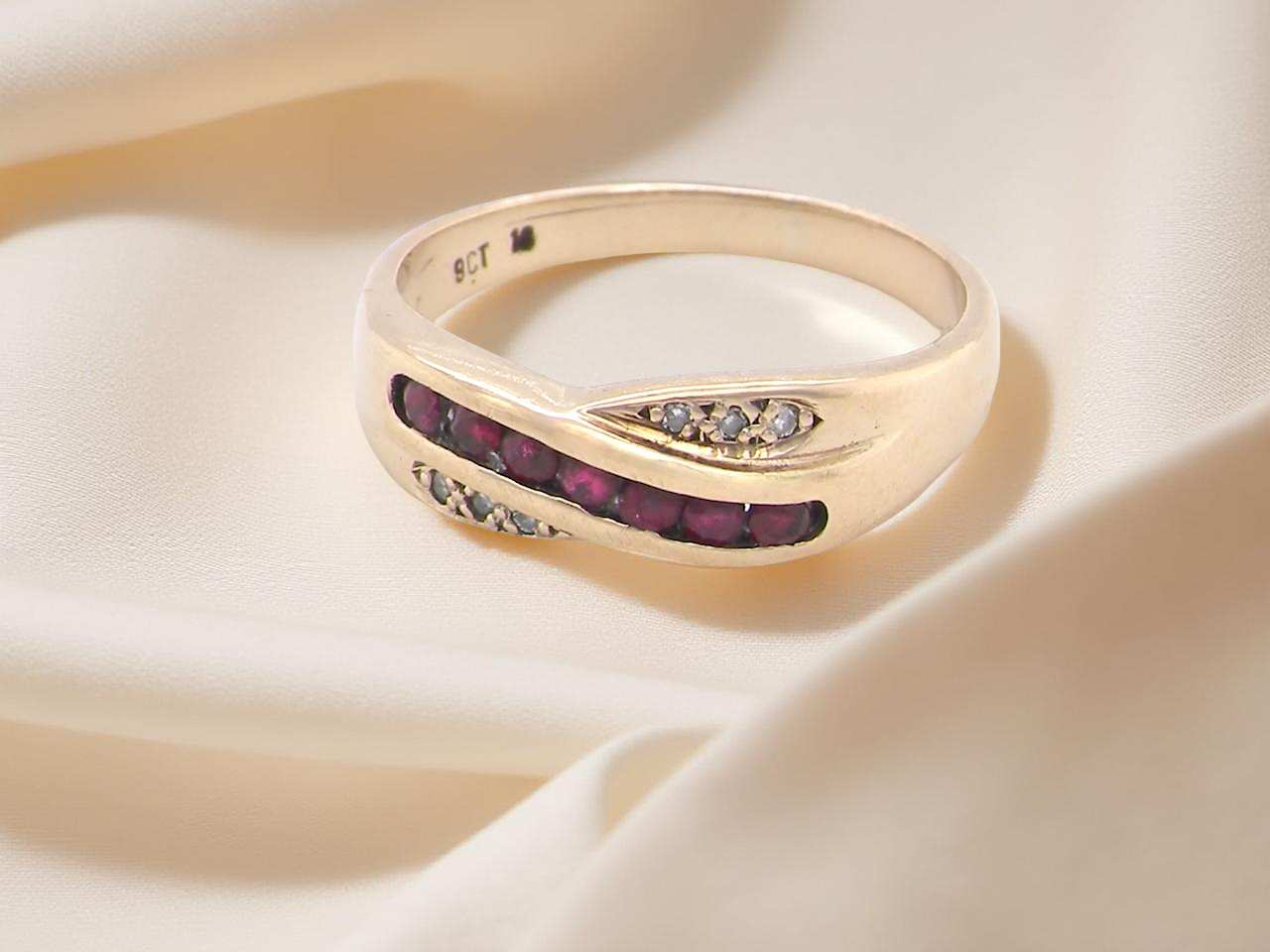 A 9 carat Gold Eternity Ring with Rubies and Diamonds