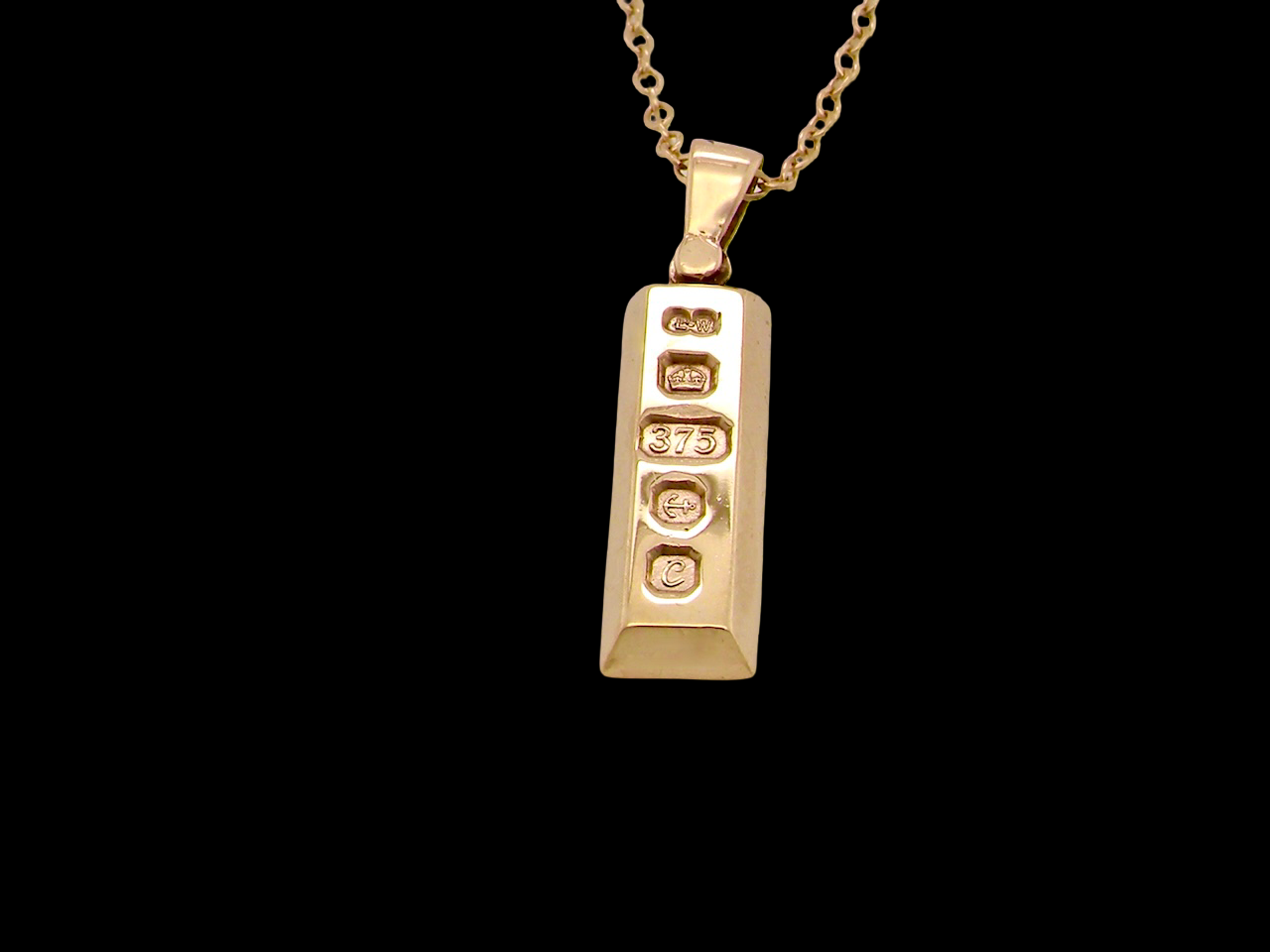 A 9 carat Yellow Gold Ingot Pendant & Chain