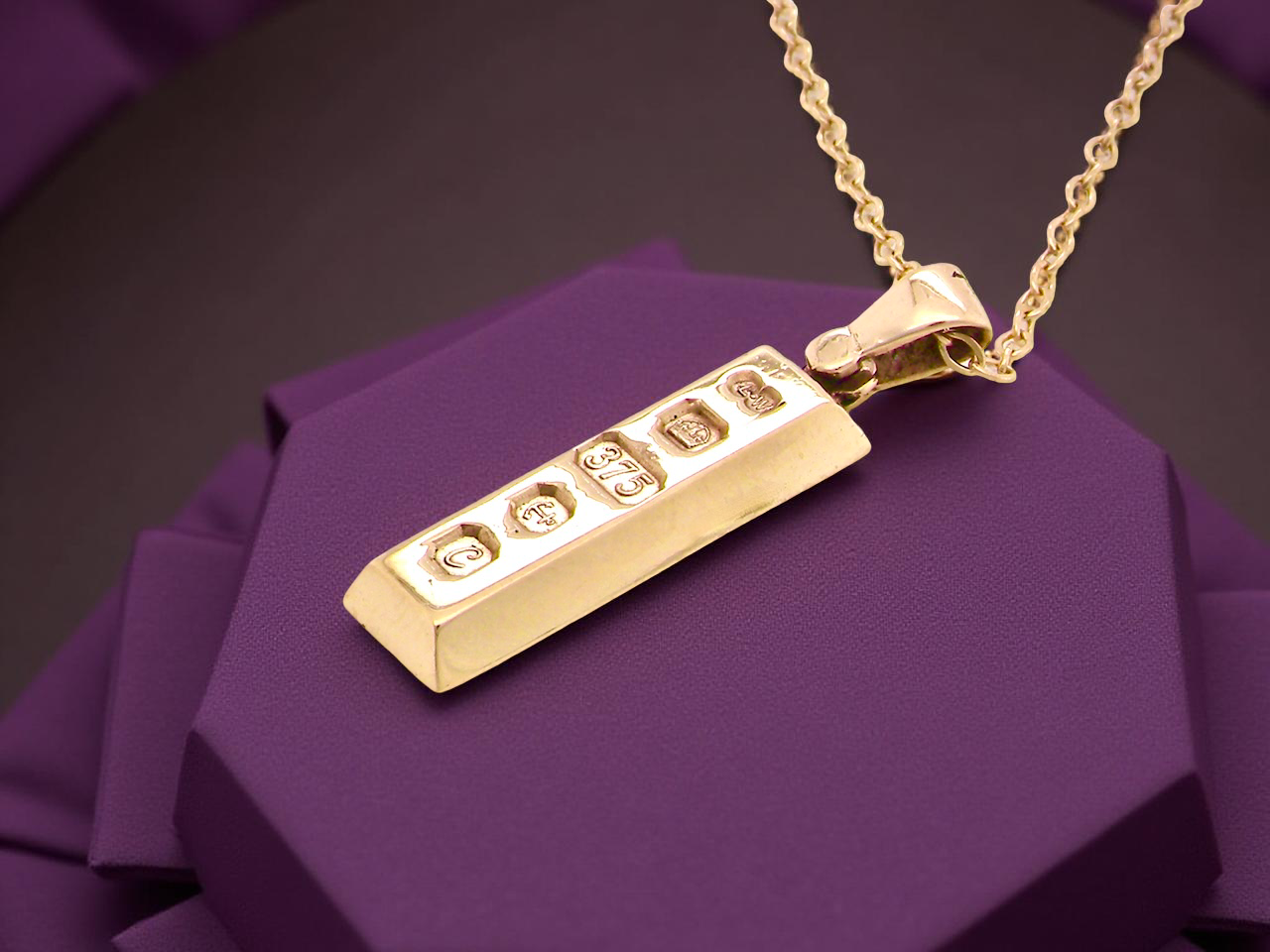 A 9 carat Yellow Gold Ingot Pendant & Chain