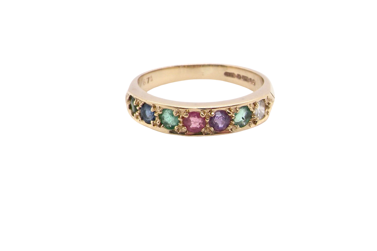 A 9 carat gold acrostic dress ring, set with various gemstones the initials of each spelling the word DEAREST.