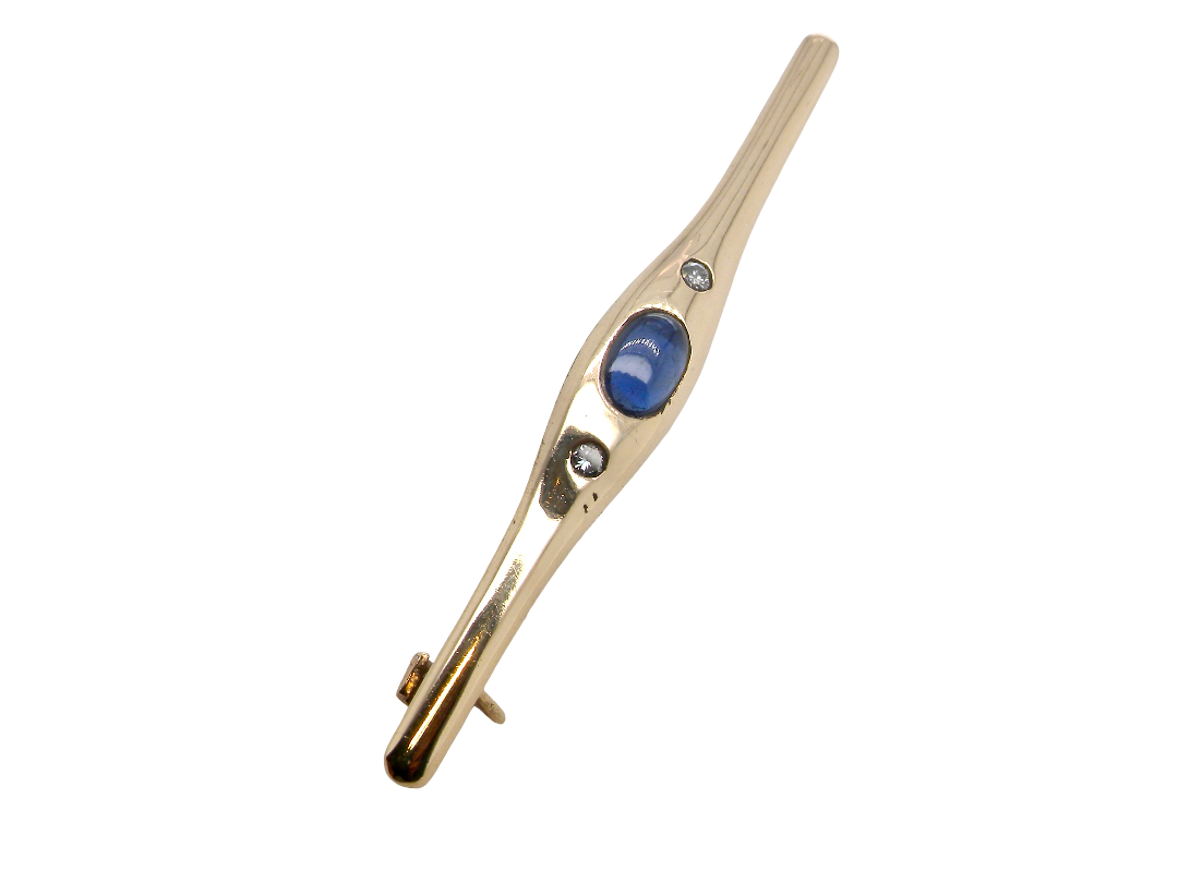 A 9 carat gold bar brooch, width 55mm. Set with a cabouchon cut sapphire,