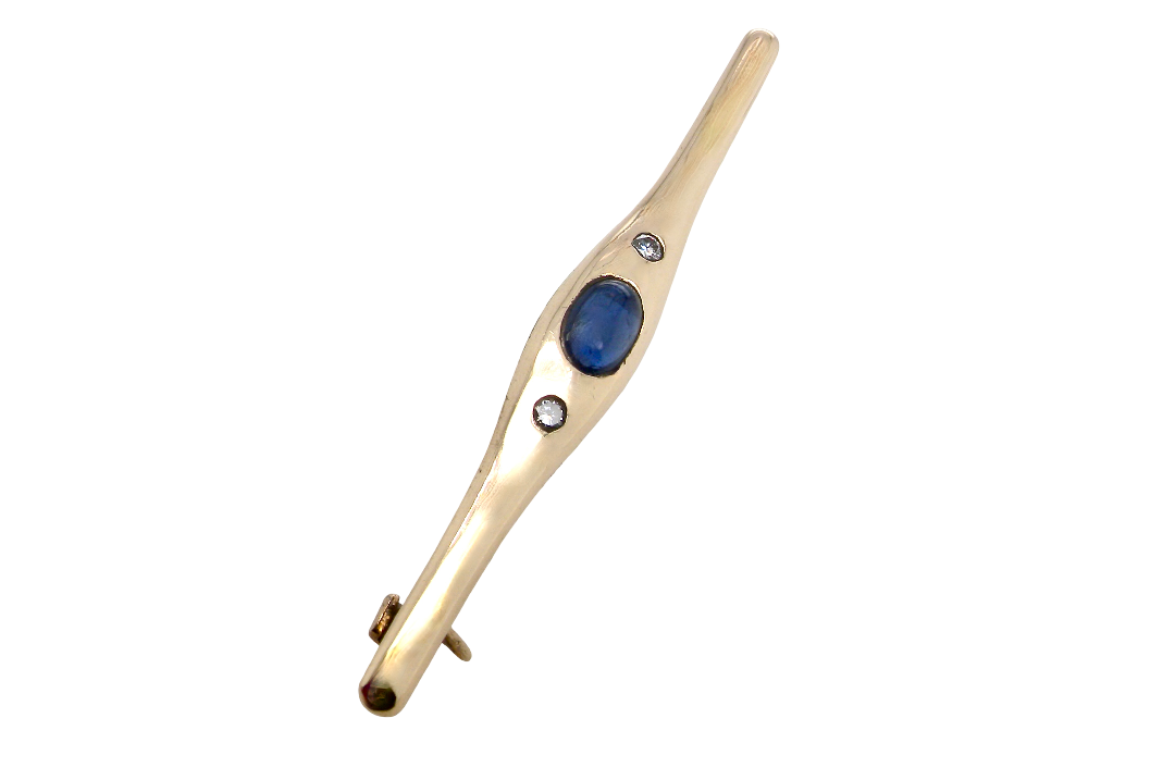 A 9 carat gold bar brooch, width 55mm. Set with a cabouchon sapphire,