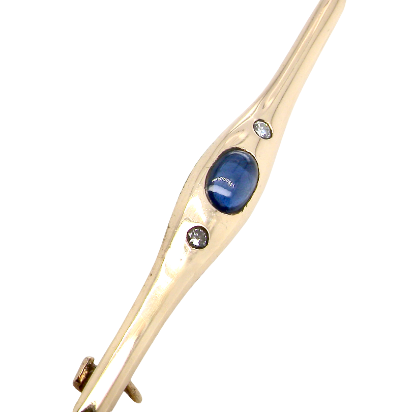 A 9 carat gold bar brooch, width 55mm. Set with a sapphire,