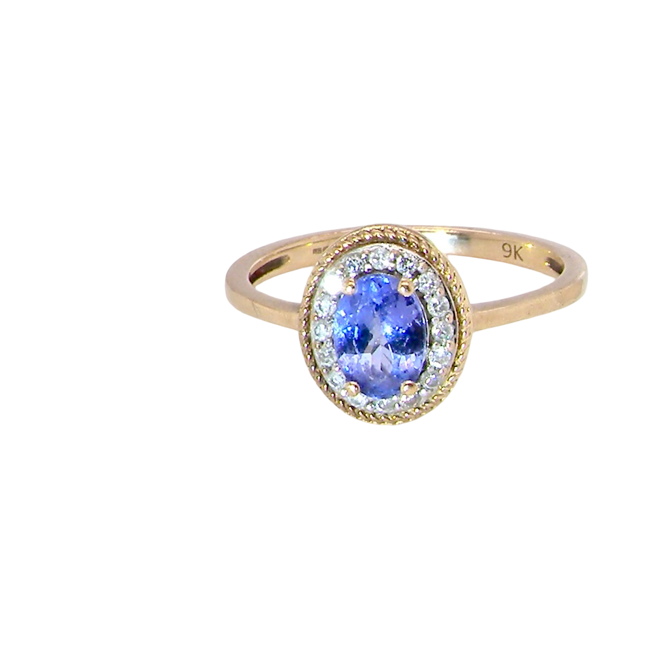 A 9 carat gold cluster ring. Features to the centre an oval cut tanzanite gem stone. Measures 7x5mm, four claw setting.