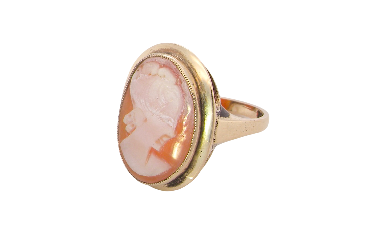 A 9 carat gold dress ring that features a cameo shell. Carved with the head of a young woman.