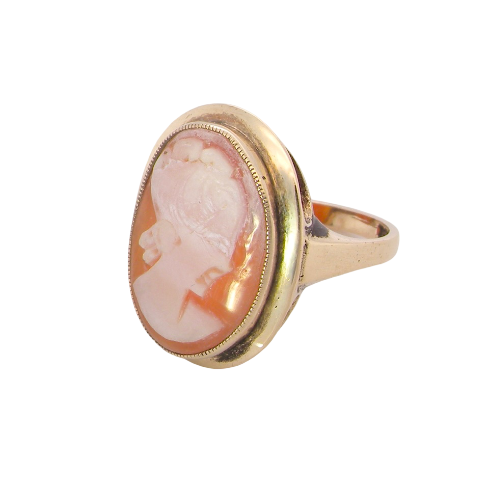 A 9 carat gold dress ring that features a cameo shell. Carved with the head of a young woman.