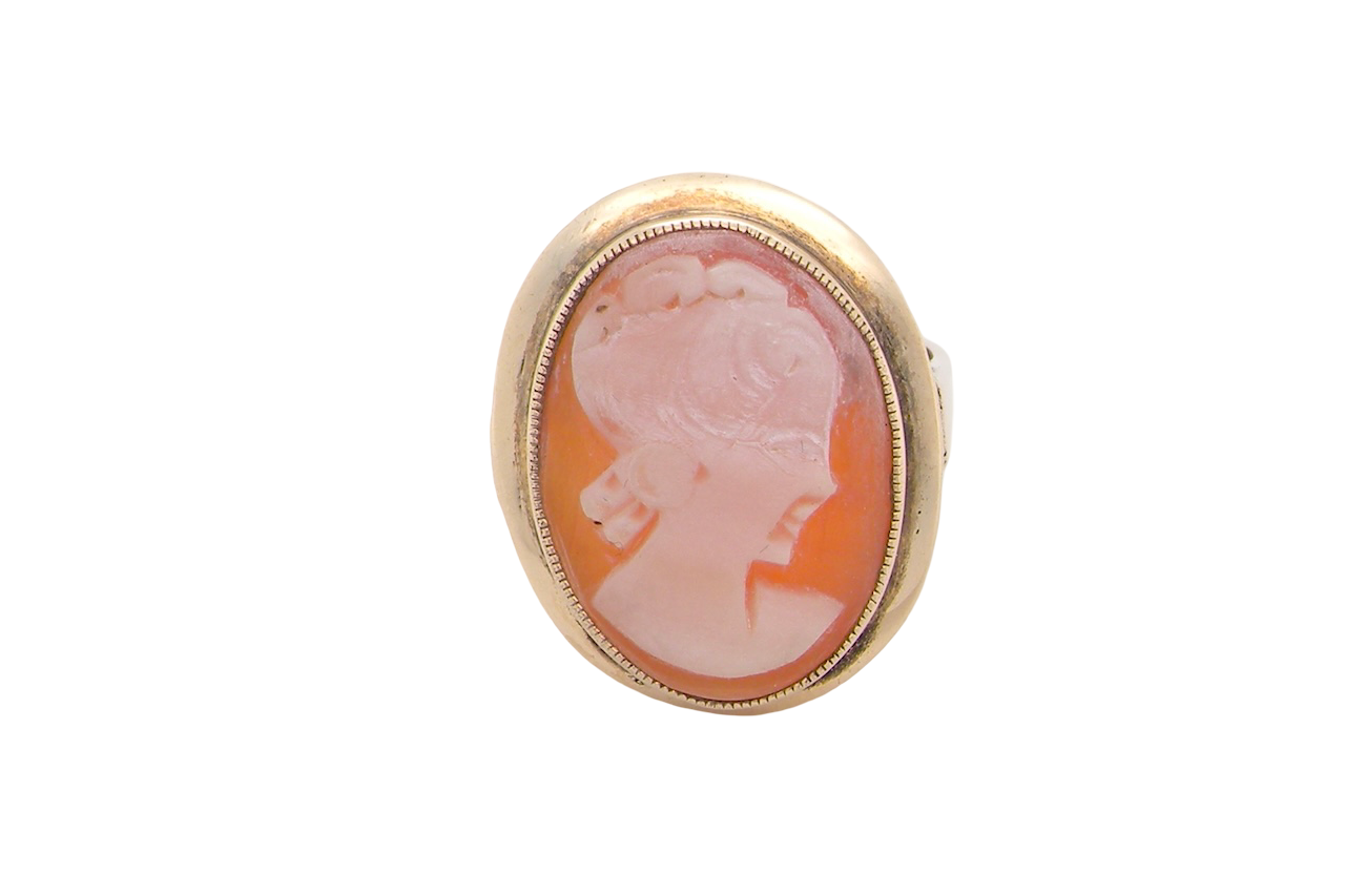 A 9 carat gold dress ring that features a cameo shell. Carved with the head of a young woman. Measures 20x15mm.