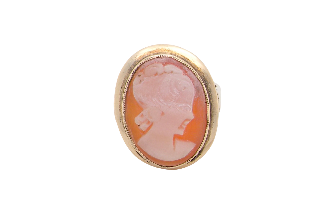 A 9 carat gold dress ring that features a cameo shell. Carved with the head of a young woman. Measures 20x15mm.