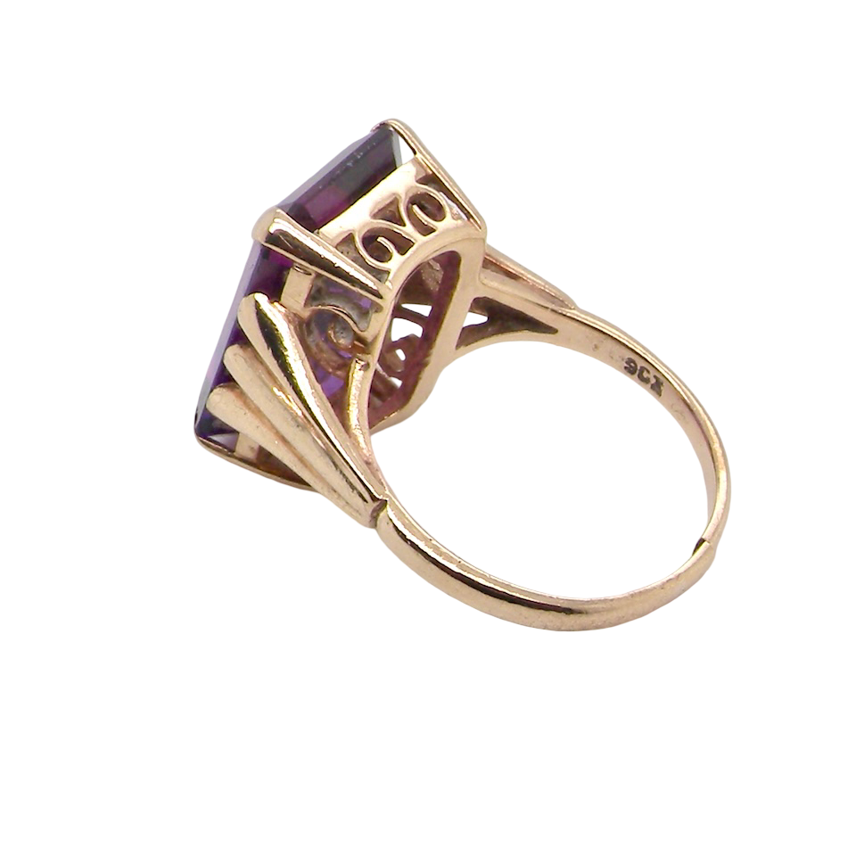 side A 9 carat gold* dress ring that is set with a substantial amethyst gemstone.