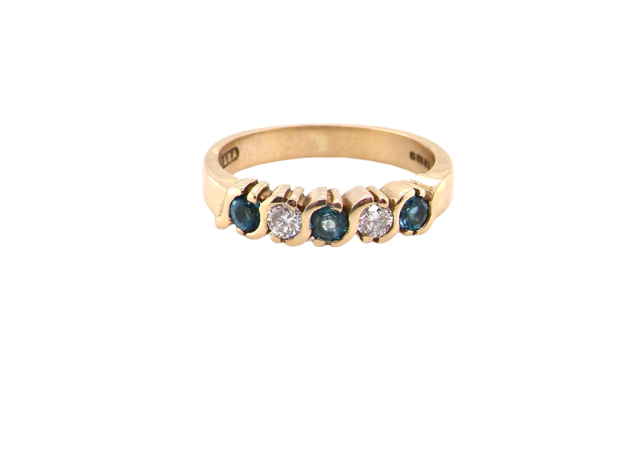 A half hoop Blue Topaz and Diamond ring