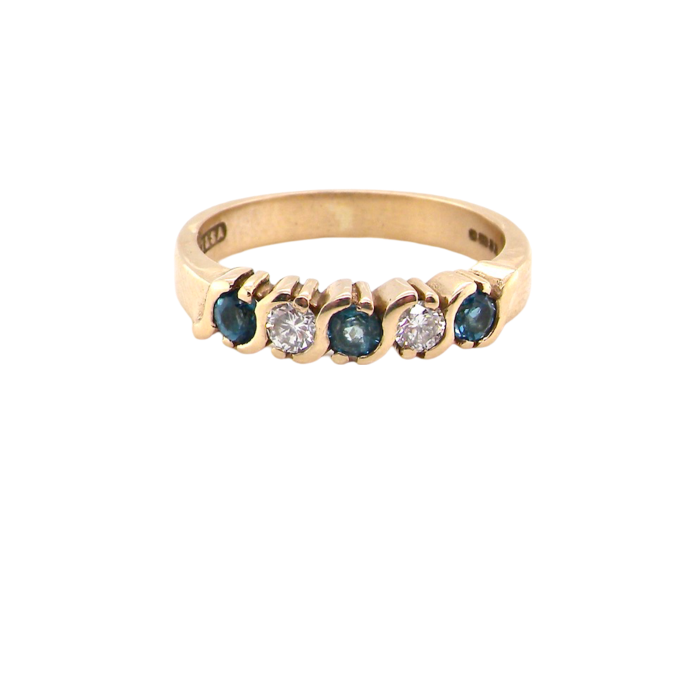 A half hoop Blue Topaz and Diamond ring