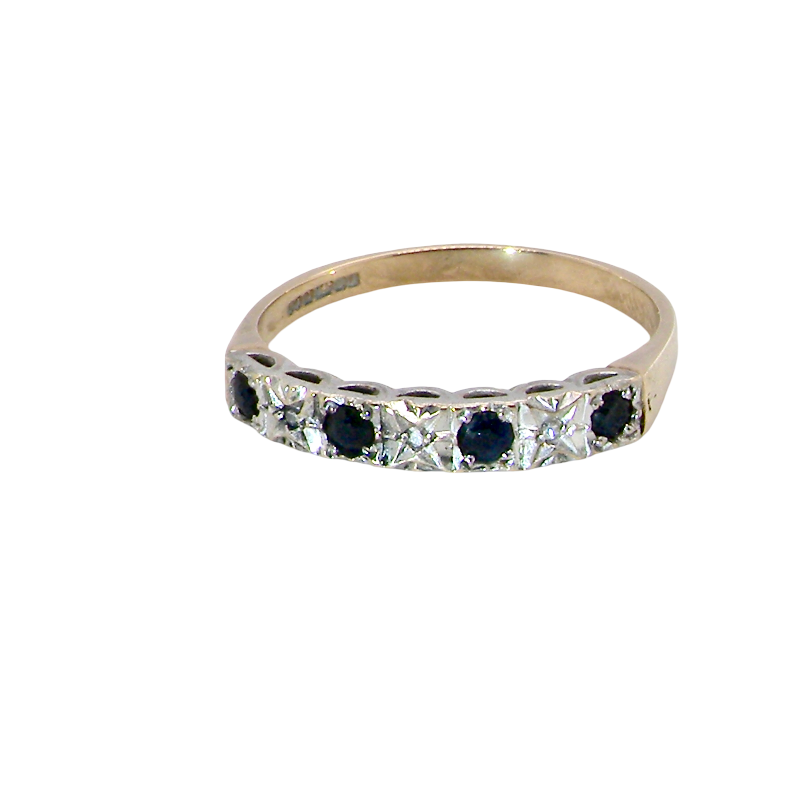 A 9 carat gold half hoop eternity ring. Set with four sapphires, each 2.4mm, and between each a 1mm illusion set diamond.