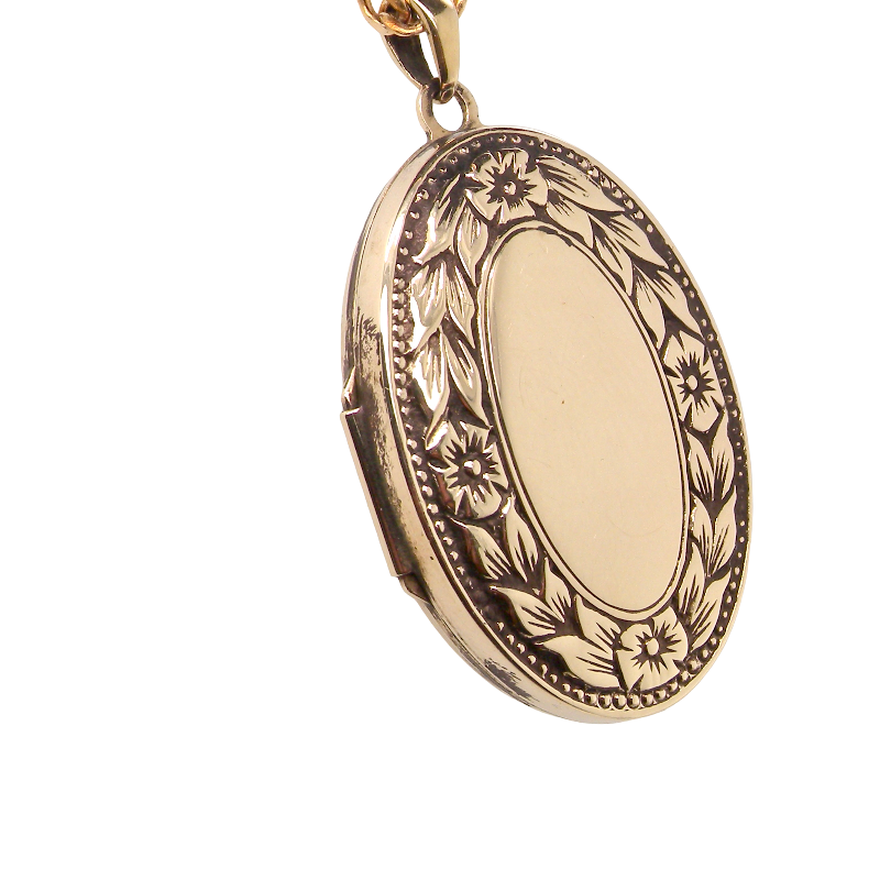 A 9 carat gold locket*, oval shaped, measures 30x20mm,