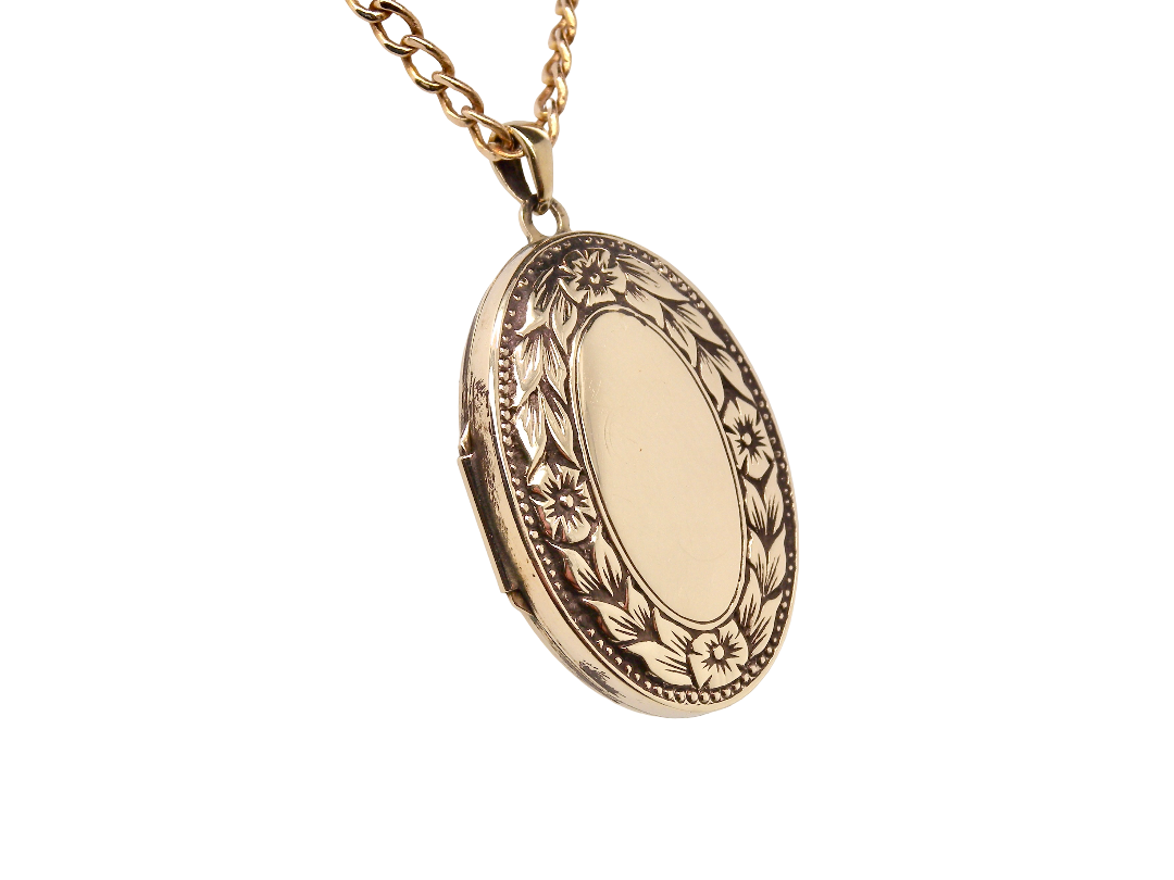 A 9 carat gold locket*, oval shaped, measures 30x20mm, depth 5mm. 