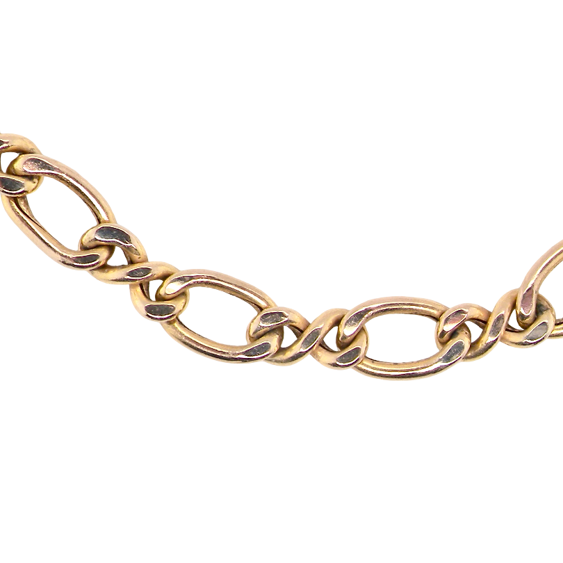 A close-up of a gold-toned chain necklace with alternating oval and twisted figure links, shown against a plain white background.